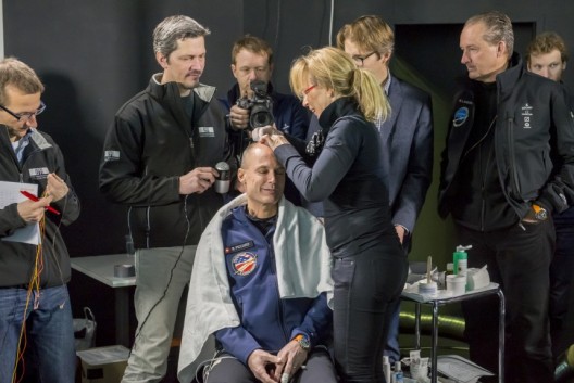 Being prepped for the simulated flight, Piccard is wired for full monitoring of EKG, ECG, and other functions