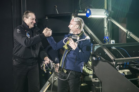 Andre' Borschberg greets Bertrand Piccard following successful 72-hour simulated crossing of Atlantic