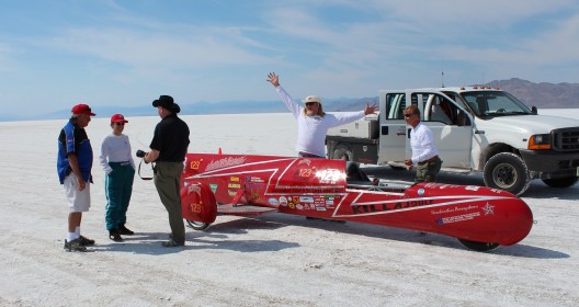 Eva, Bill and team celebrate record.  Note salt clinging to undersides of vehicles