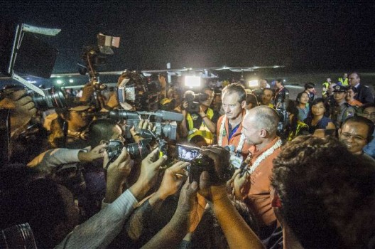 Andre' Borschber gnad Bertrand Piccard are surrounded by reporters and photographers after Piccard landed HB-SIB in Mandalay, Myanmar.  Photo Solar Impulse | Revillard
